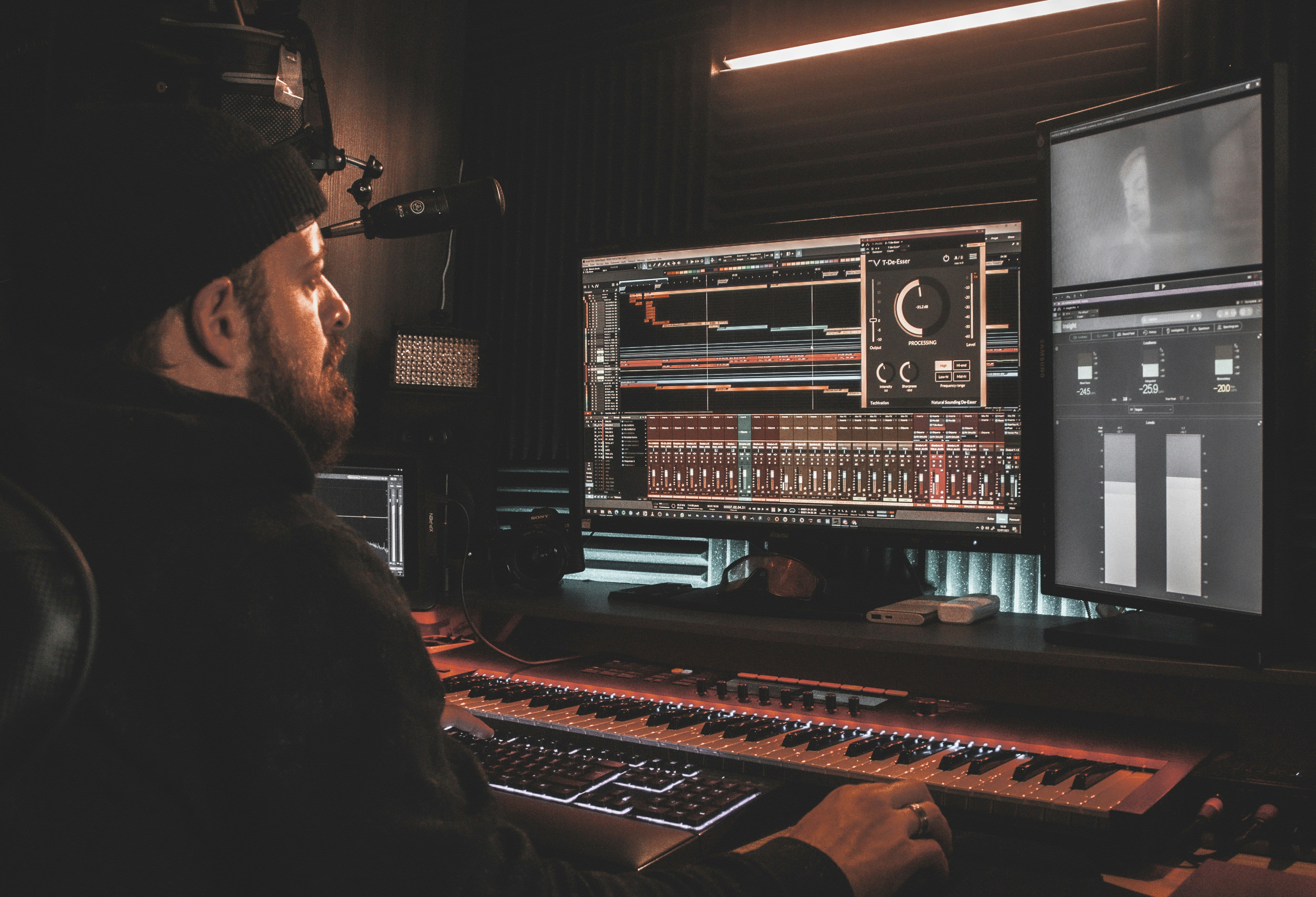 Producer staring at a complex DAW session with dozens of tracks