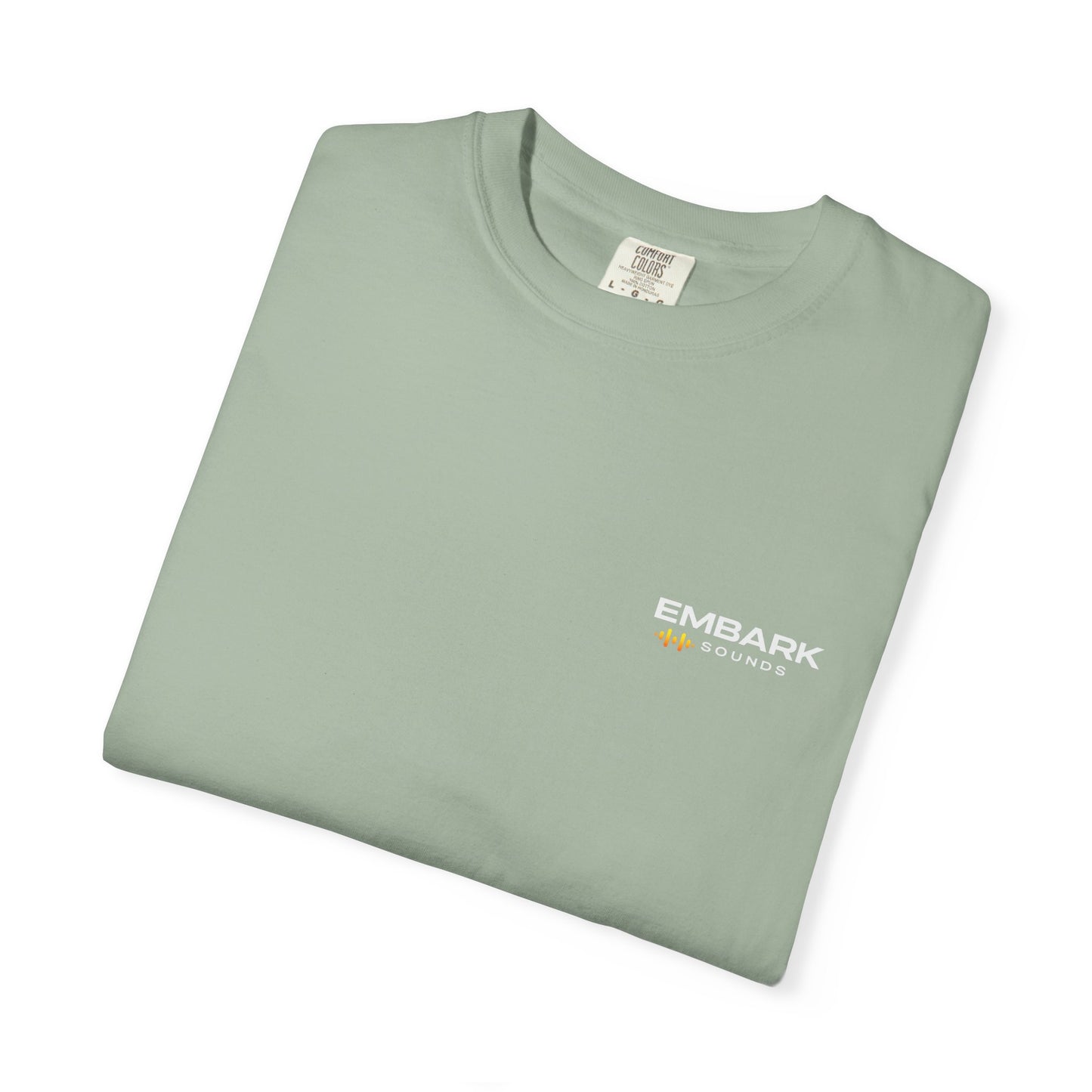 Folded teal t-shirt with 'Embark Sounds' text on a white background