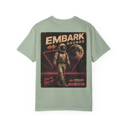 Light green t-shirt with an astronaut graphic and 'Embach Sounds' text on a white background