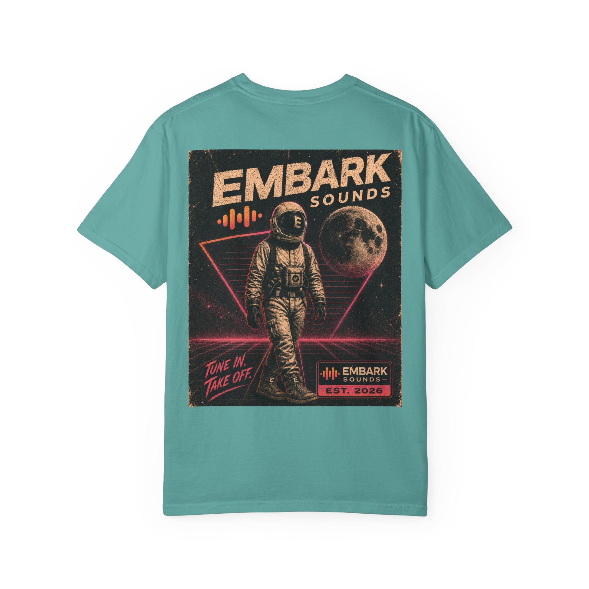 Teal t-shirt with an astronaut graphic and 'Em bark Sounds' text on a white background
