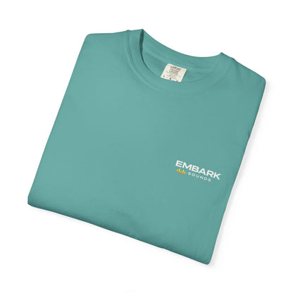 Folded gray t-shirt with a small logo on a white background