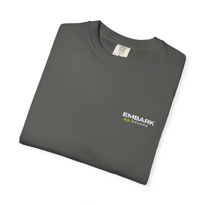 Folded gray t-shirt with a small logo on a white background