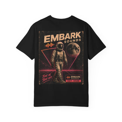 Black t-shirt with an astronaut graphic and 'Embark Sounds' text on a white background