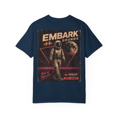 Navy blue t-shirt with an astronaut graphic and 'Embark Sounds' text on a white background