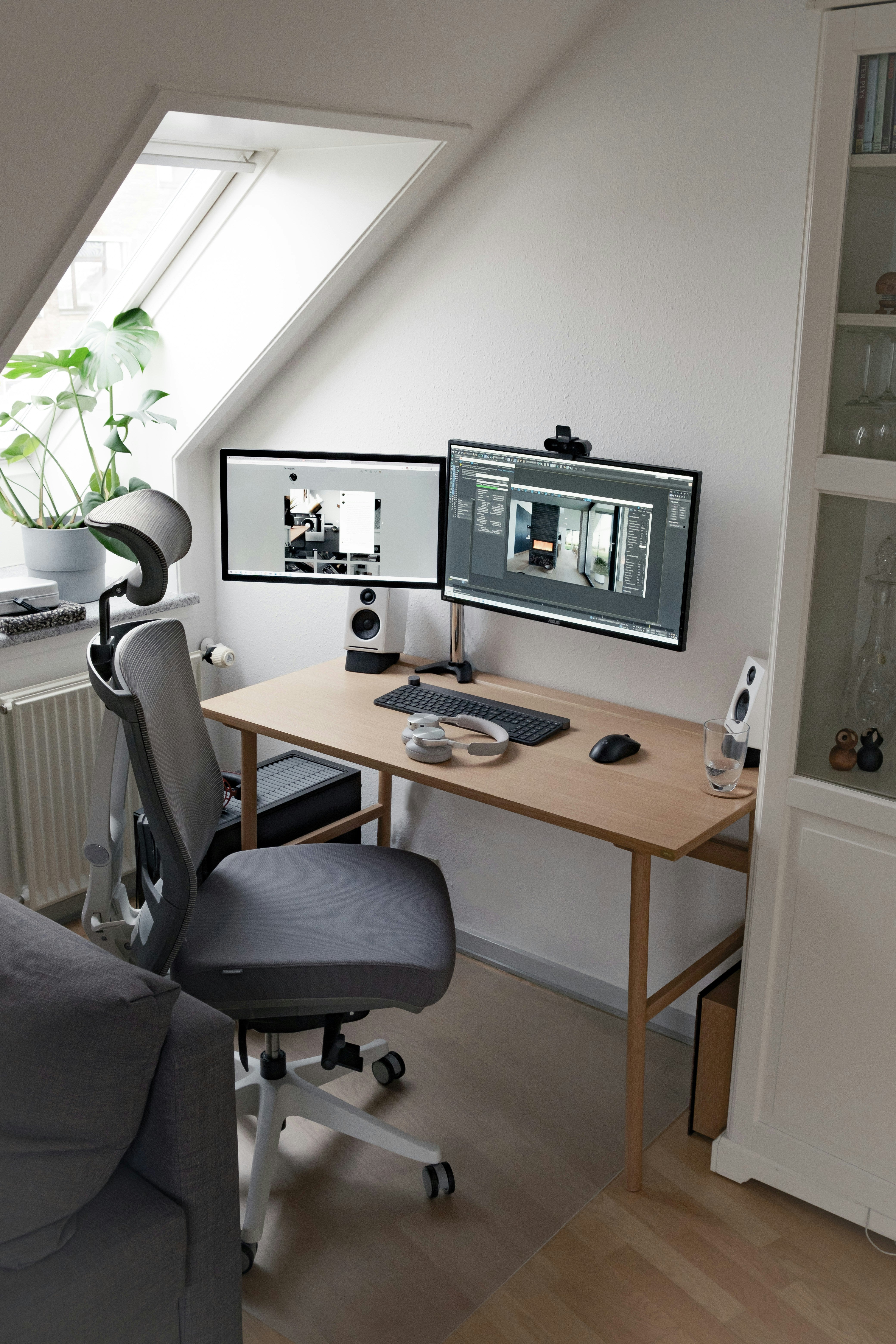 Minimal home studio with dual monitors and headphones on a wooden desk — organized workspace for a producer choosing their first DAW